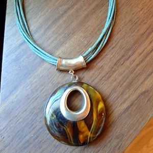 Tortoise Circle Pendant On Multi Strand Green Cord Necklace